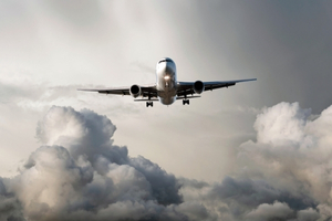 jet_airplane_flying_from_storm